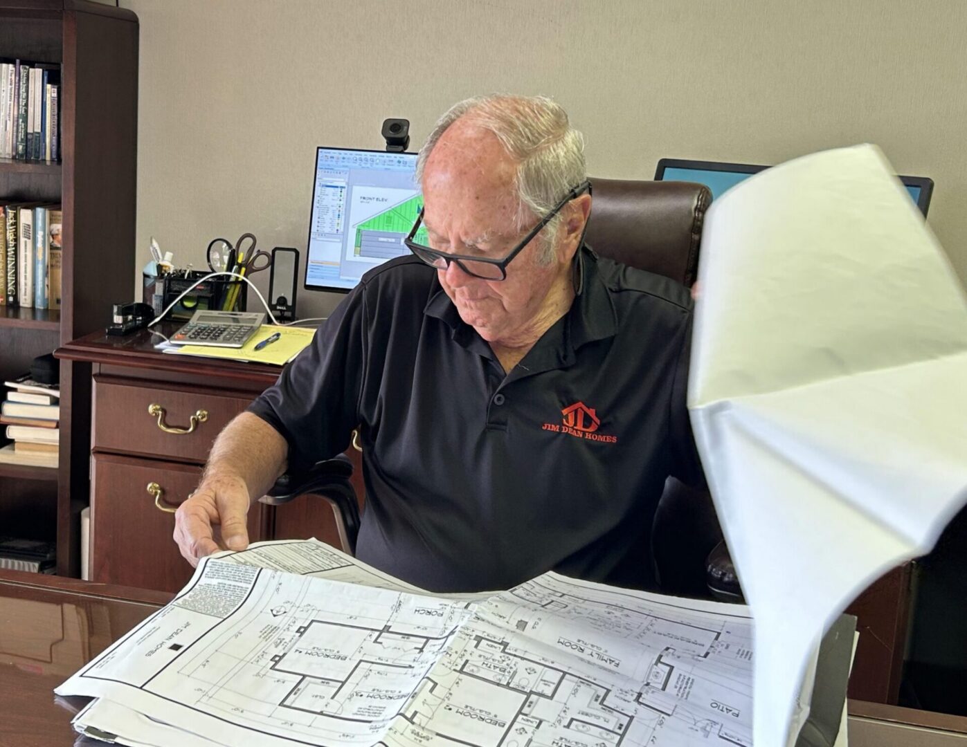 Architect reviewing building plans in office